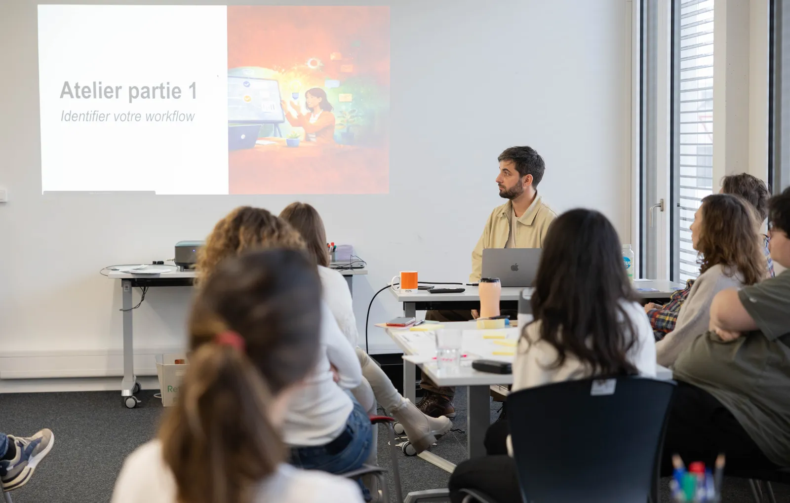 Participants du bootcamp n8n 2026 à Lausanne en atelier avec Emmanuel Bernard